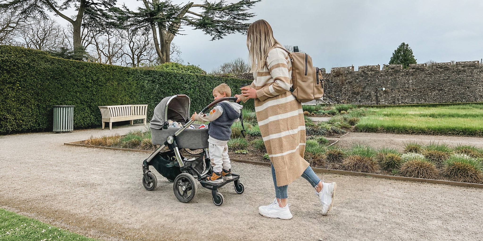 Mother and child out for a walk using the buggy board.